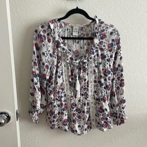 NWOT. Flowy American Rag blouse with ruffles and tassels.